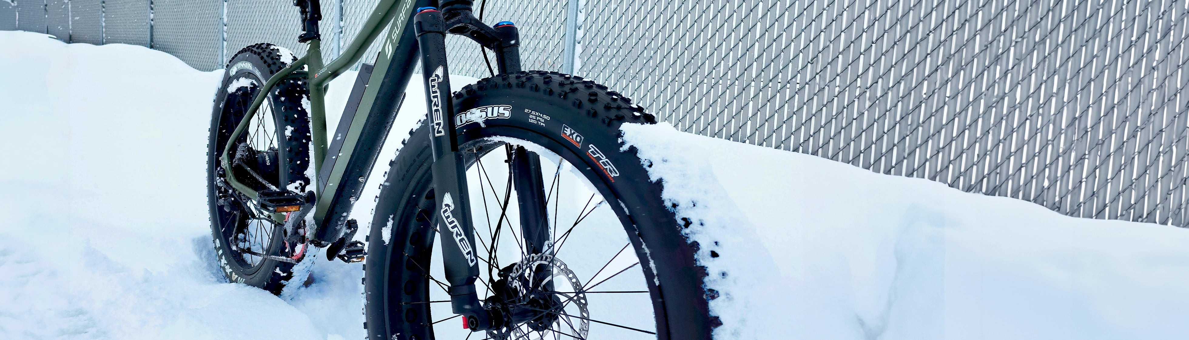 Surface 604 eBike sitting on top of snow patch